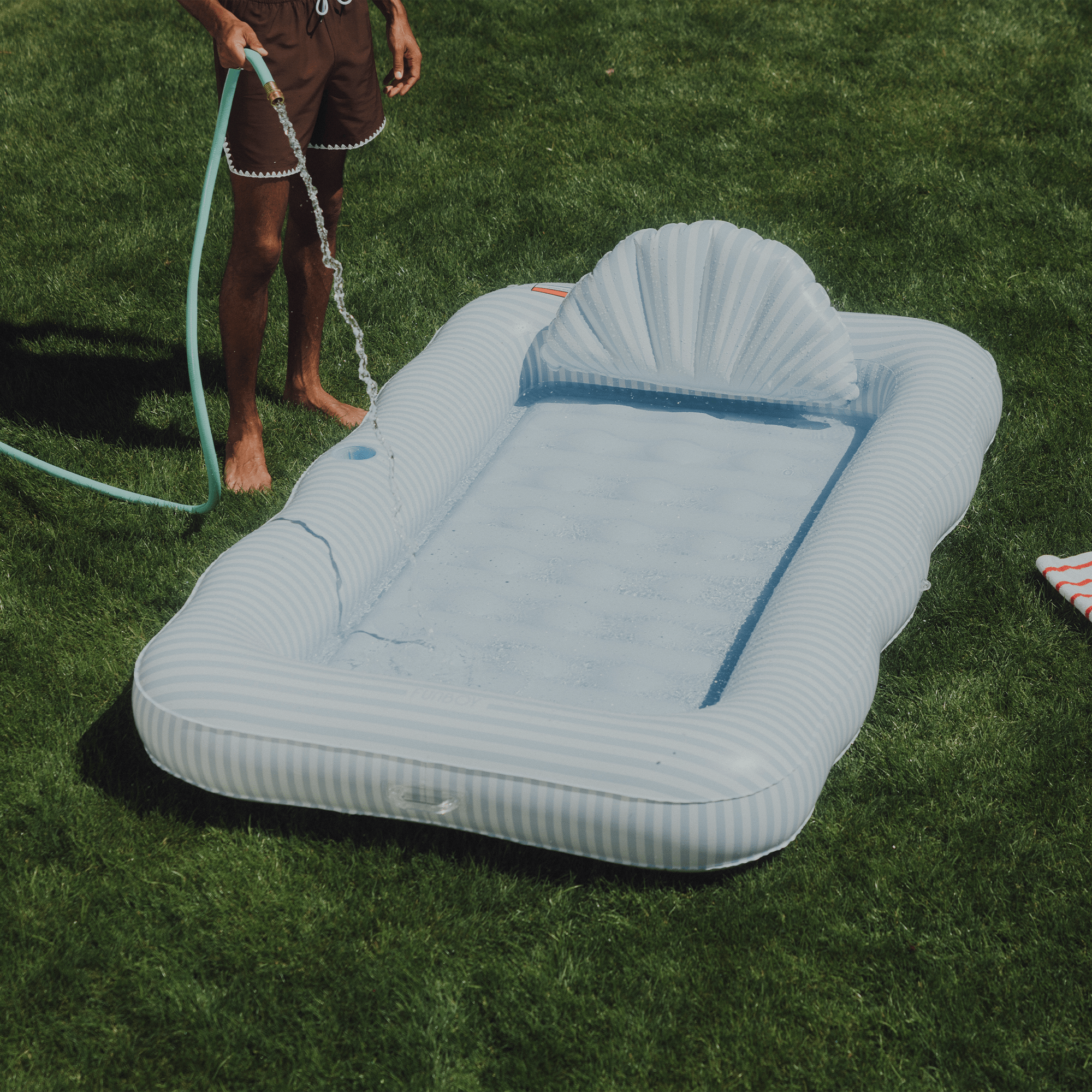 Tanning Pool Lounger: Blue & White Stripes | FUNBOY Near Me